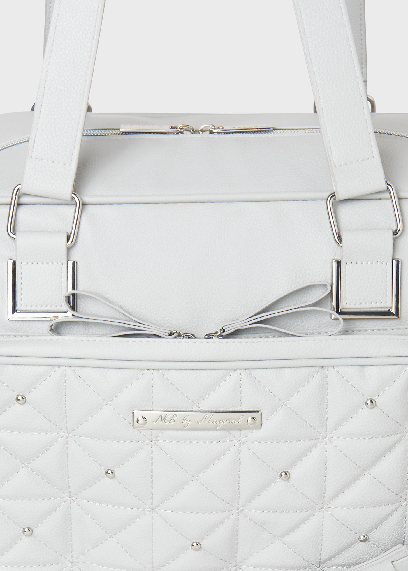 Changing bag with appliques and dummy holder