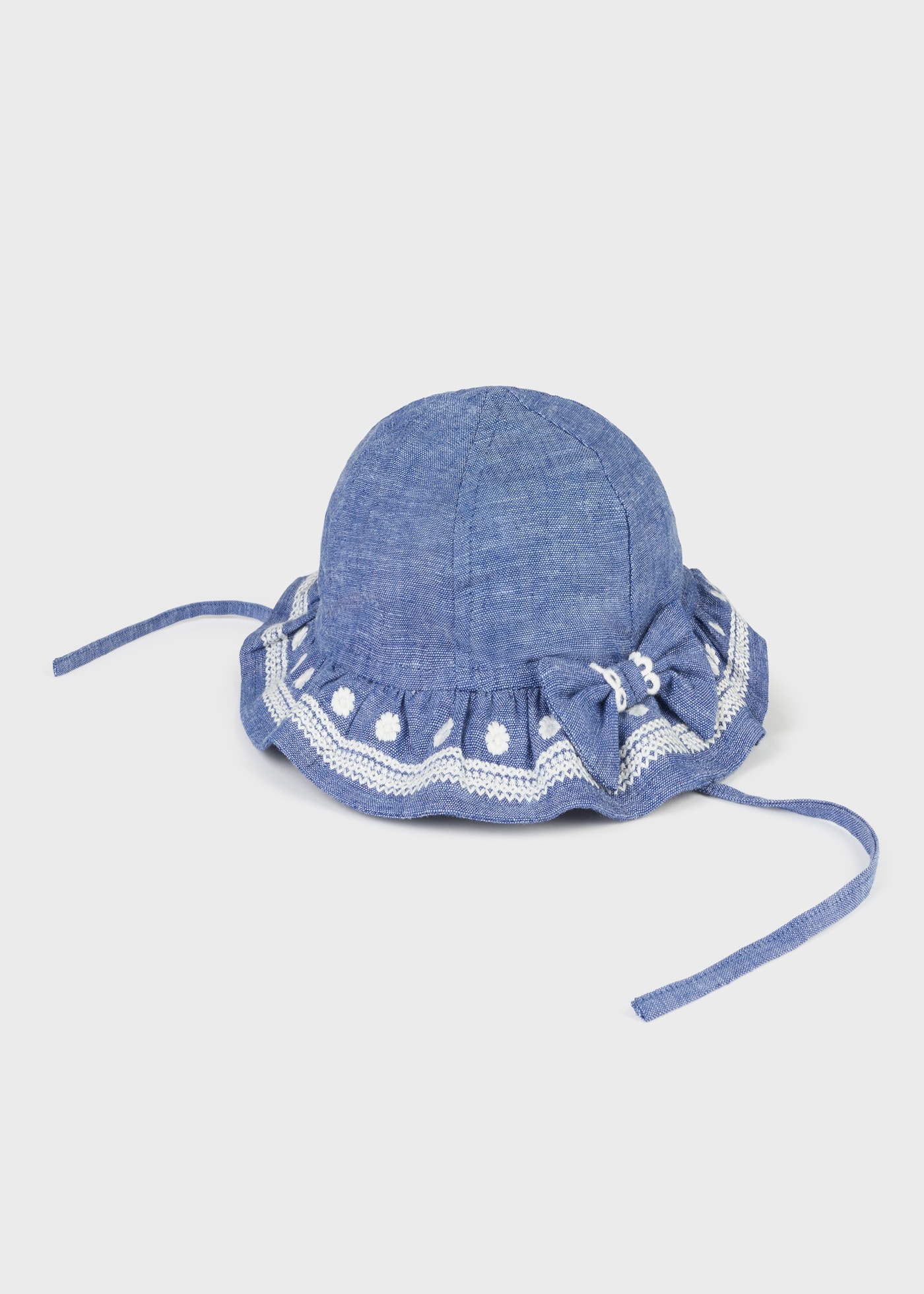 Cappello in lino ricamato neonata
