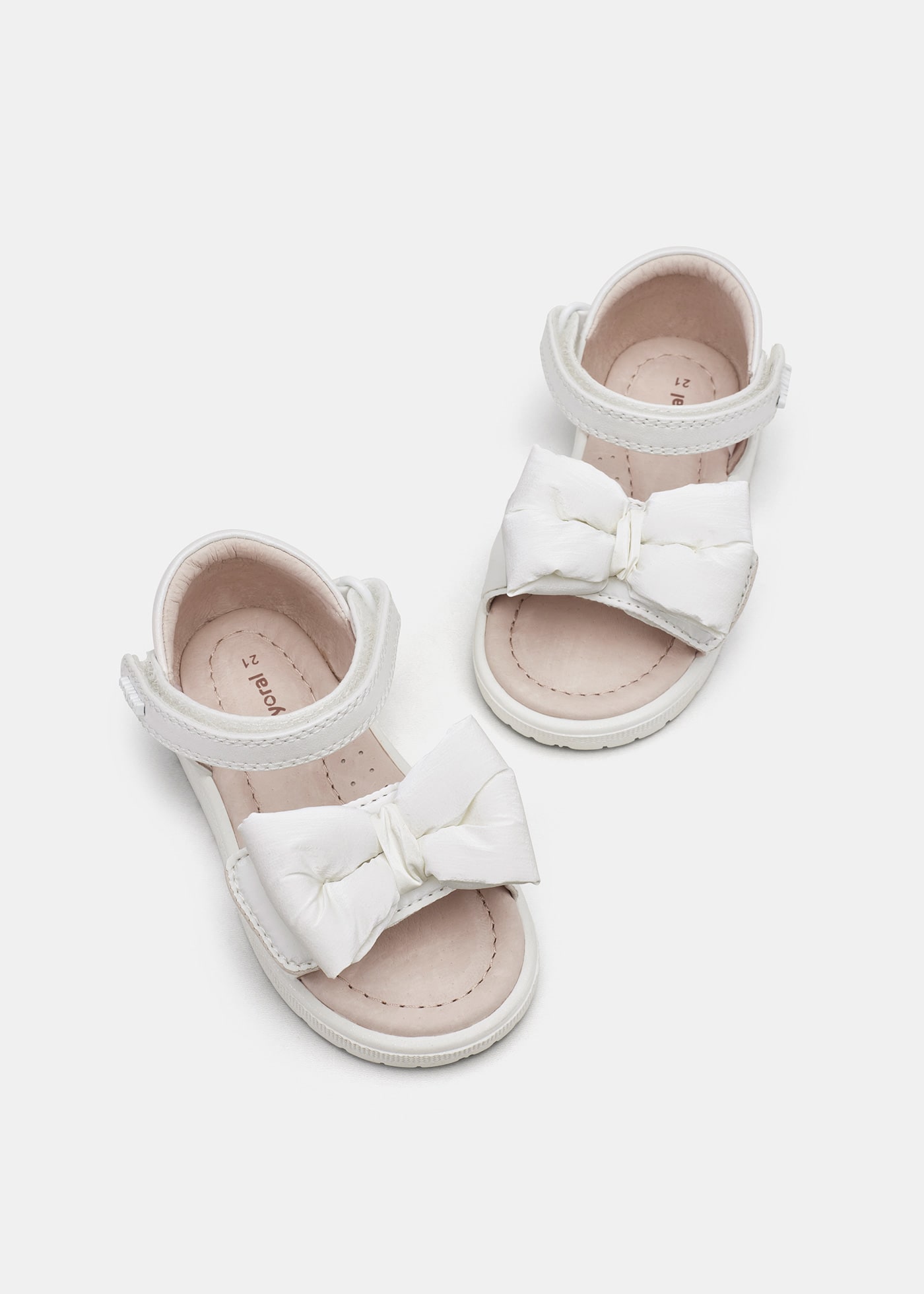 Sandali fiocco soletta in pelle sostenibile neonata