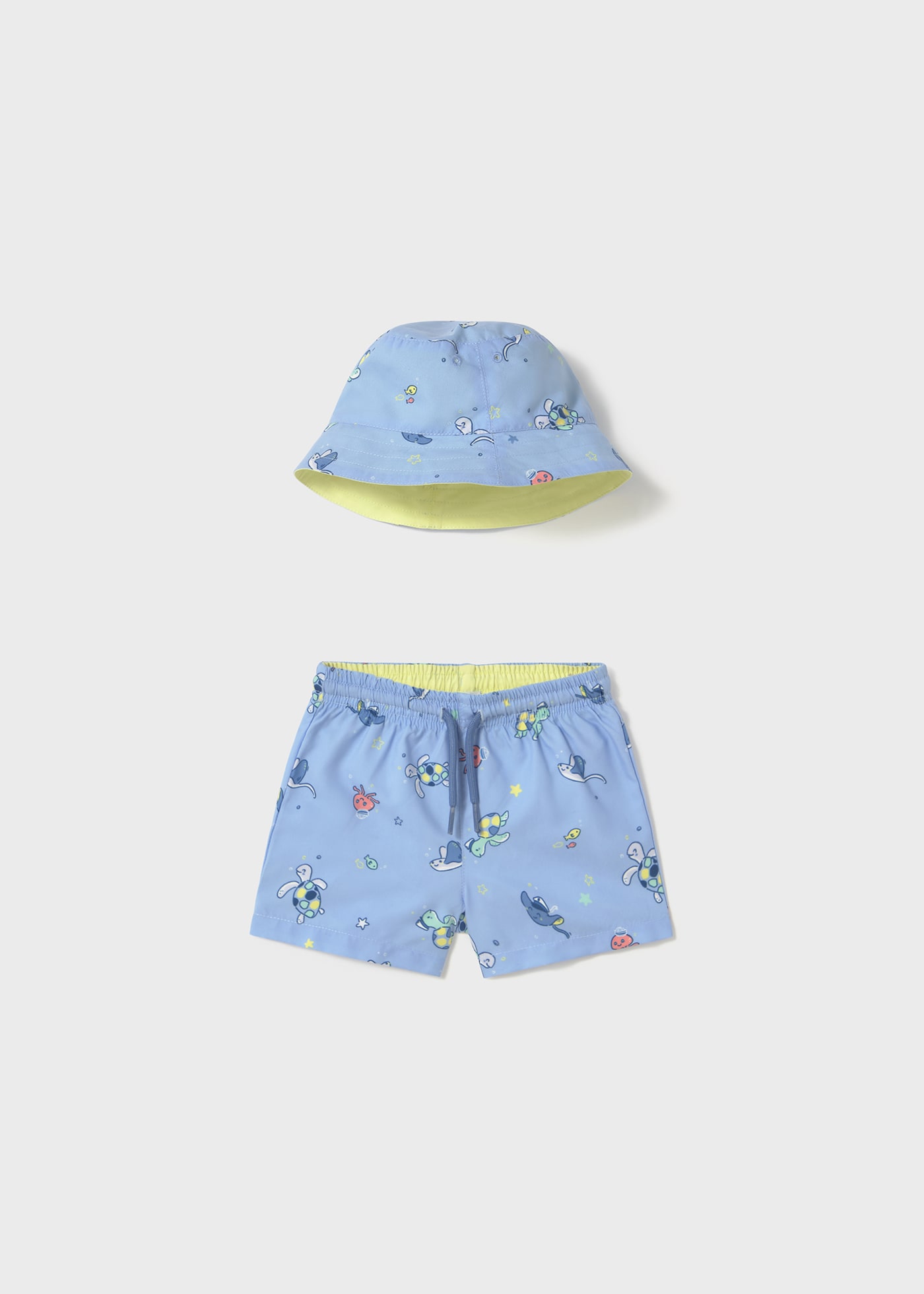 Conjunto bañador y gorro reversible protección solar bebé