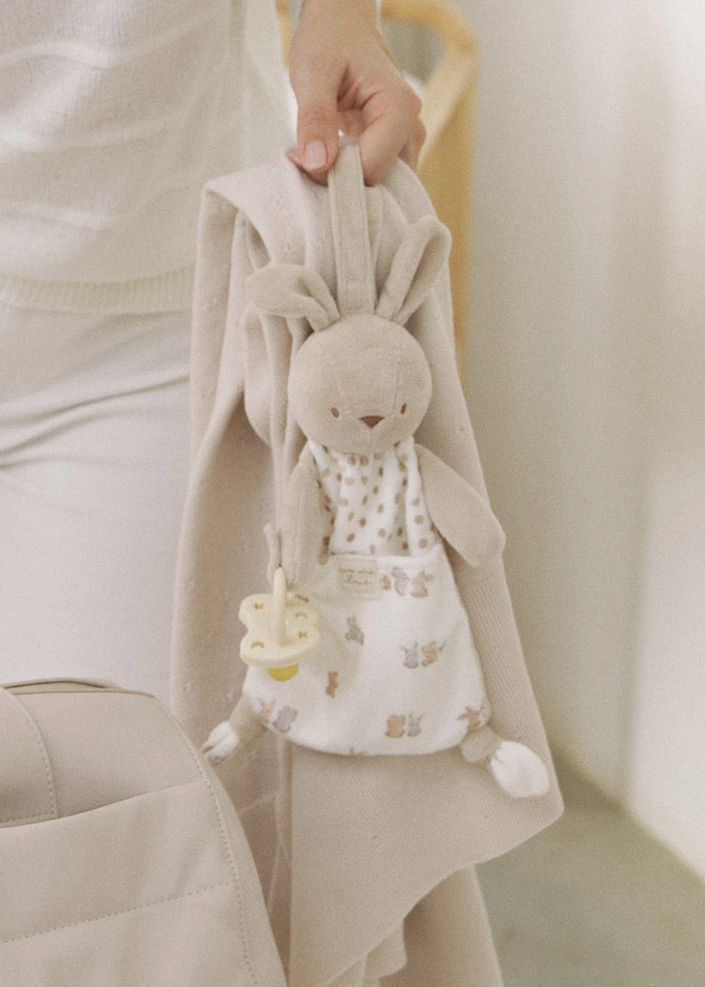 Baby soft toy with dummy holder