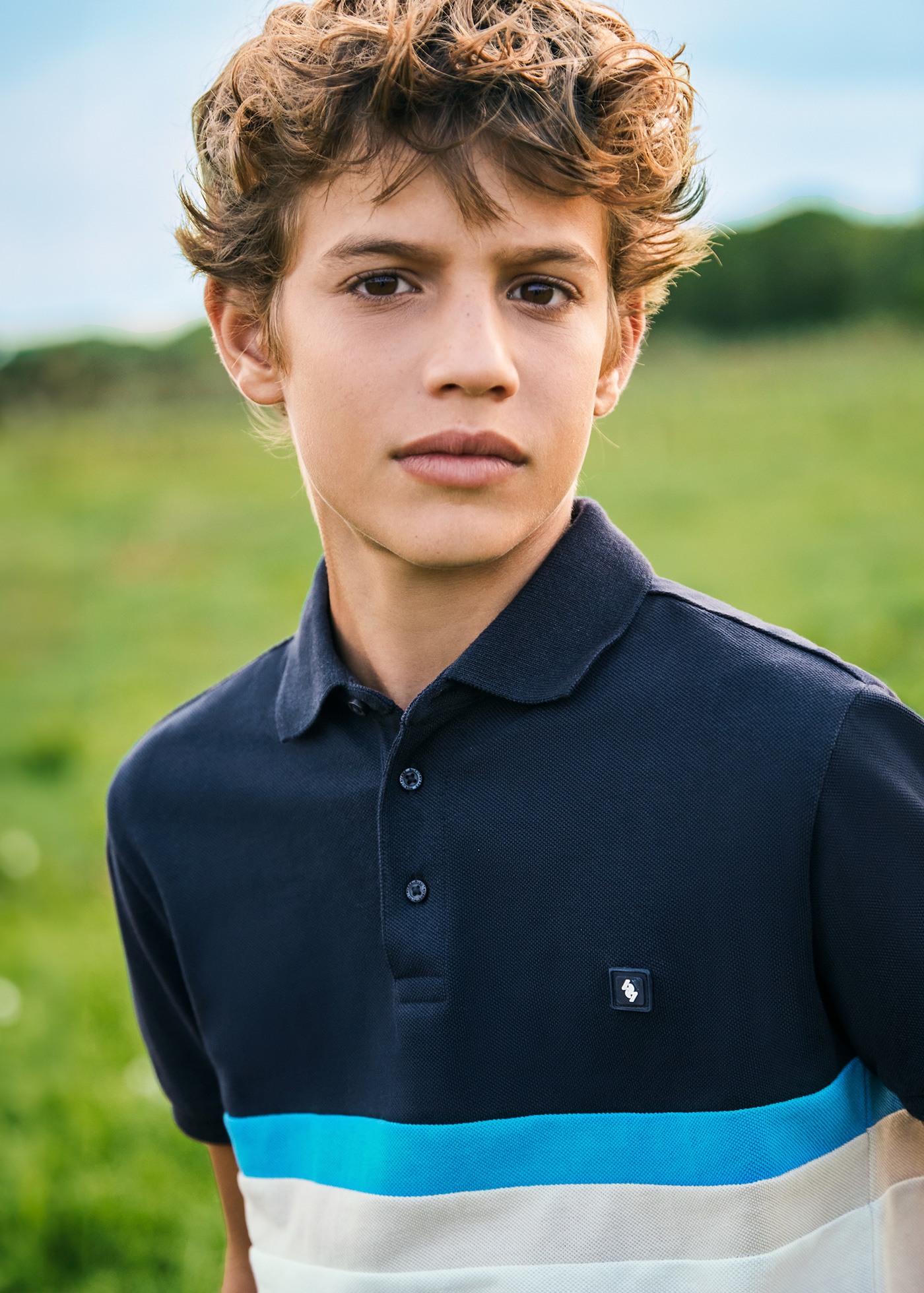 Boys color block polo shirt Better Cotton