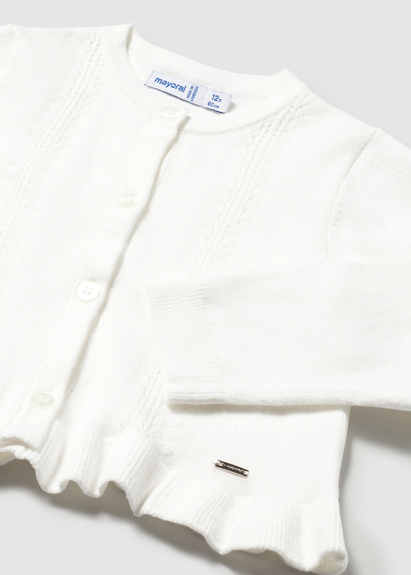 Sweter niemowlęcy z falbanką