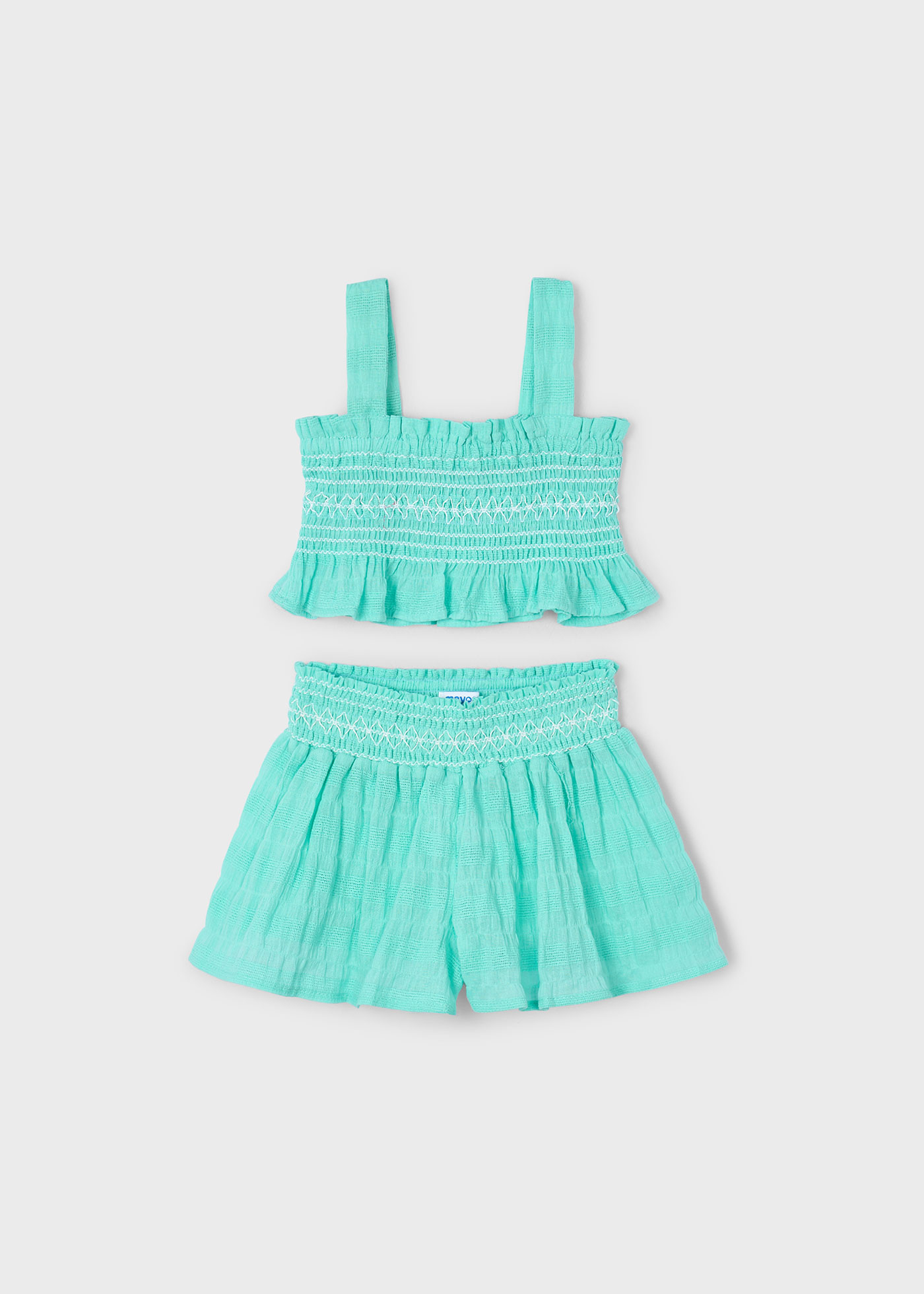 Conjunto pantalón corto y top nido de abeja niña