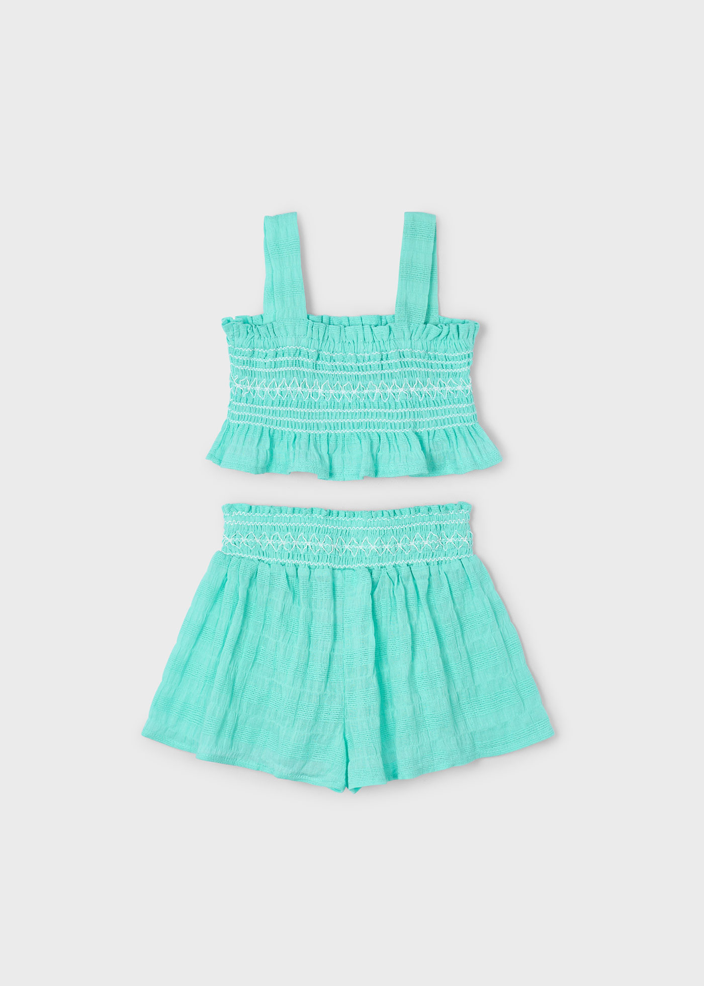 Conjunto pantalón corto y top nido de abeja niña