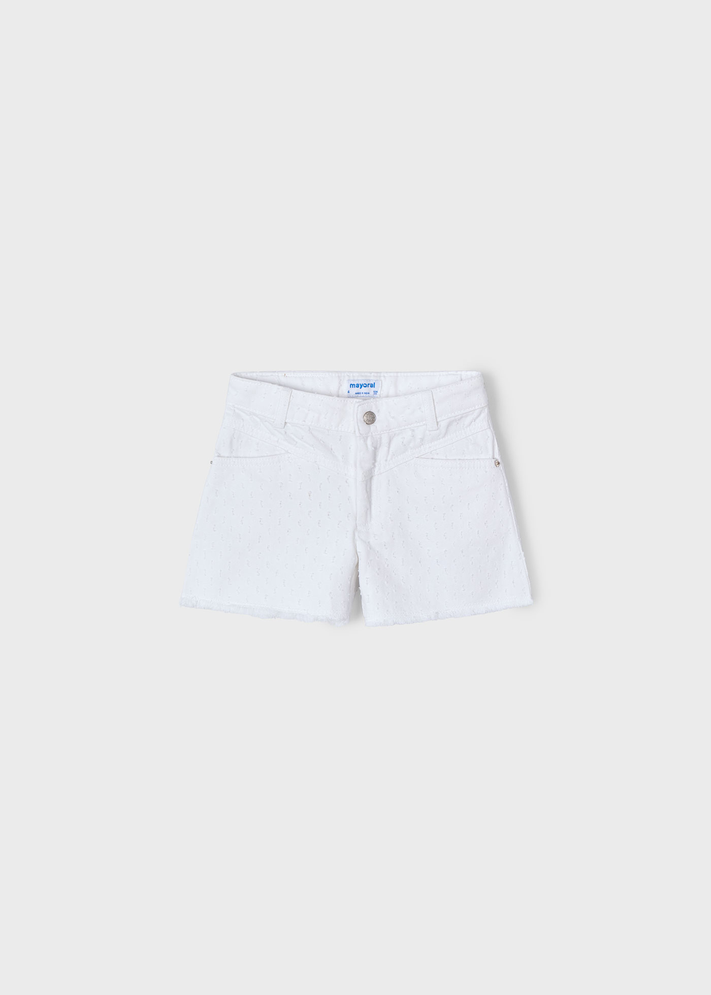 Pantalón corto bajo desflecado niña