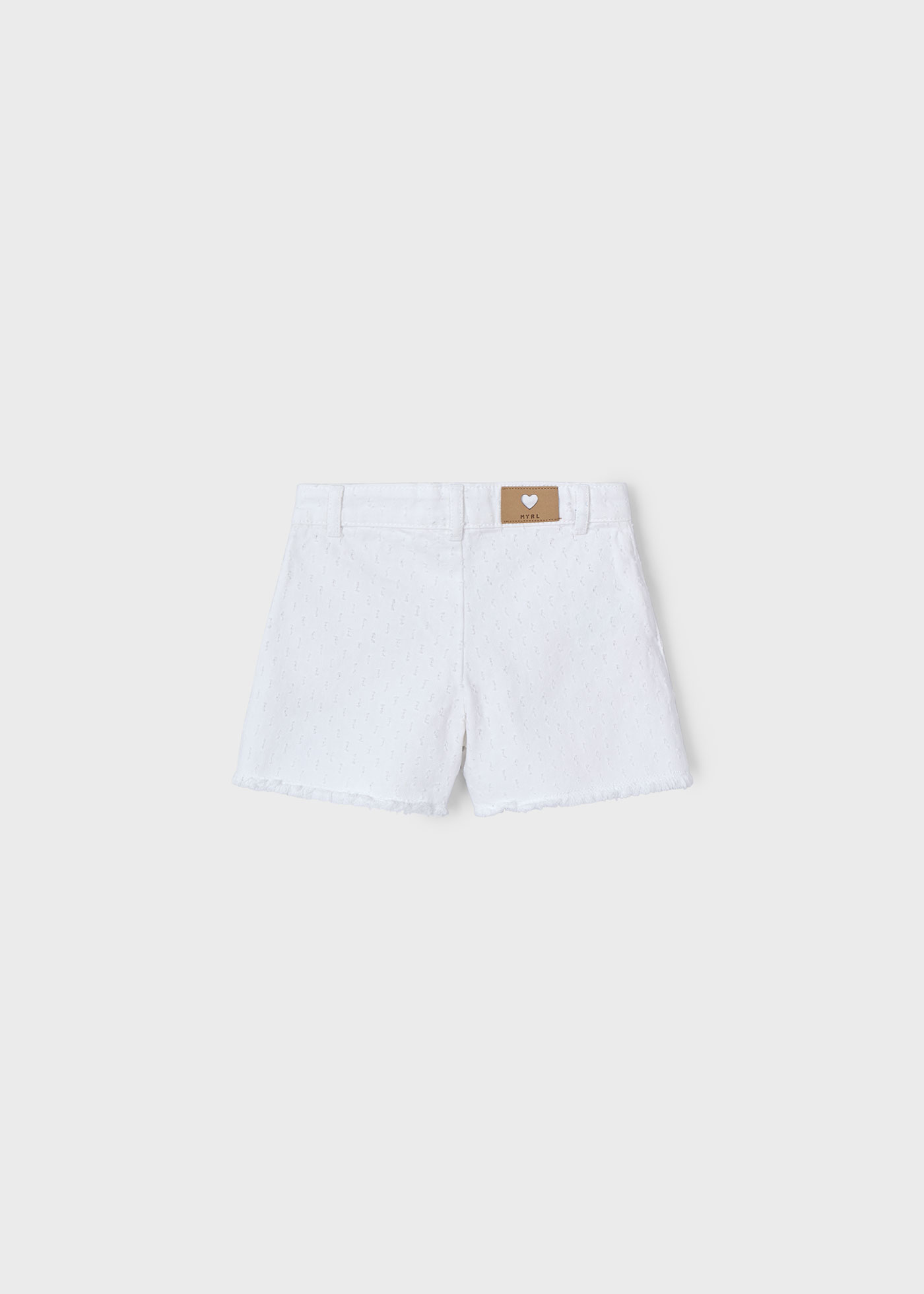 Pantalón corto bajo desflecado niña