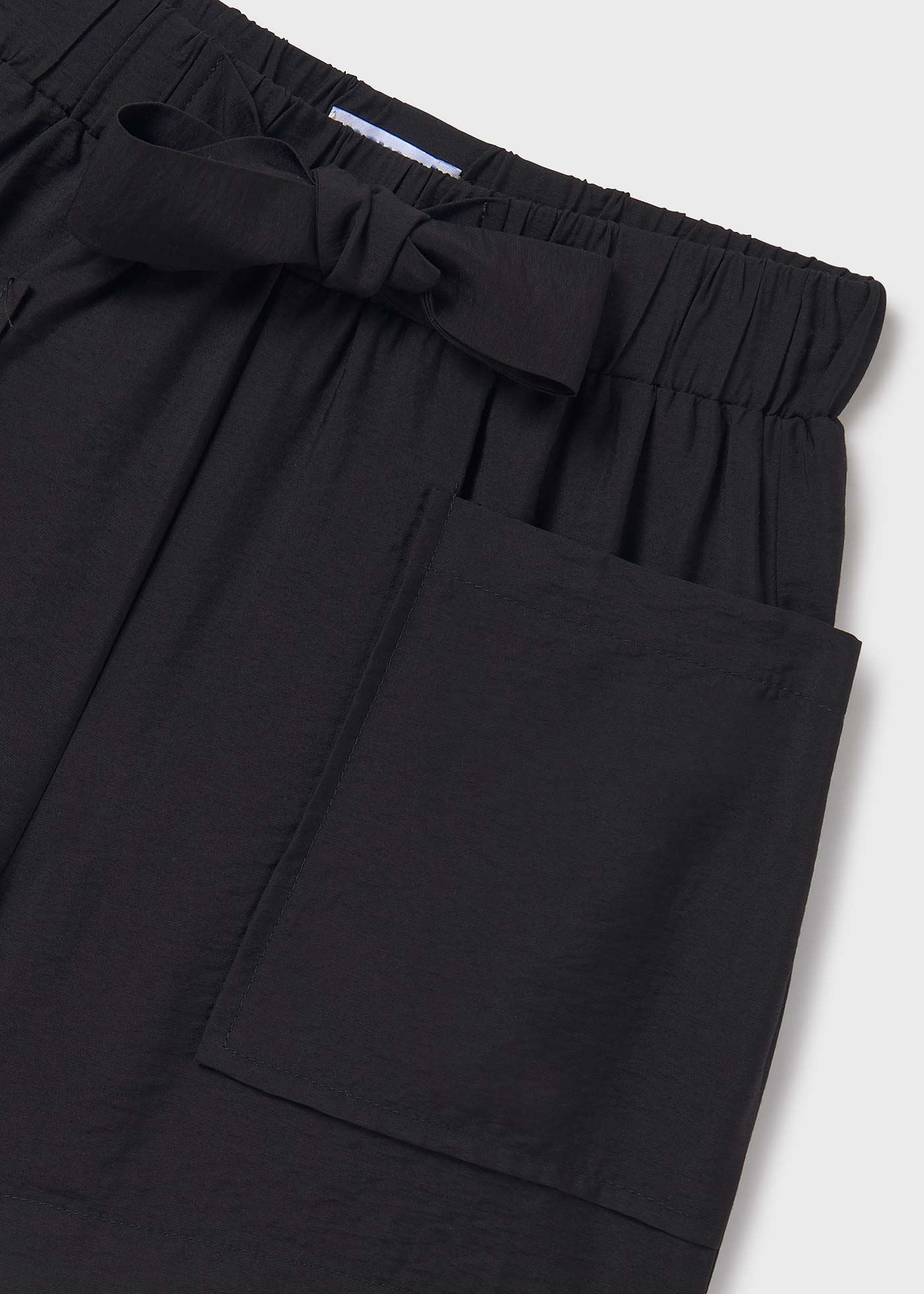 Pantalón corto bolsillos chica