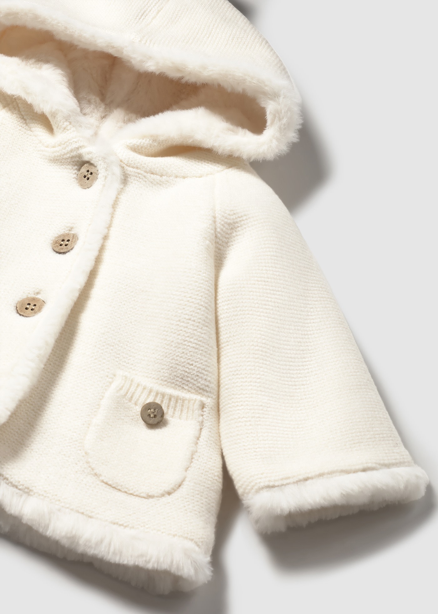 Newborn knitted jacket with fur