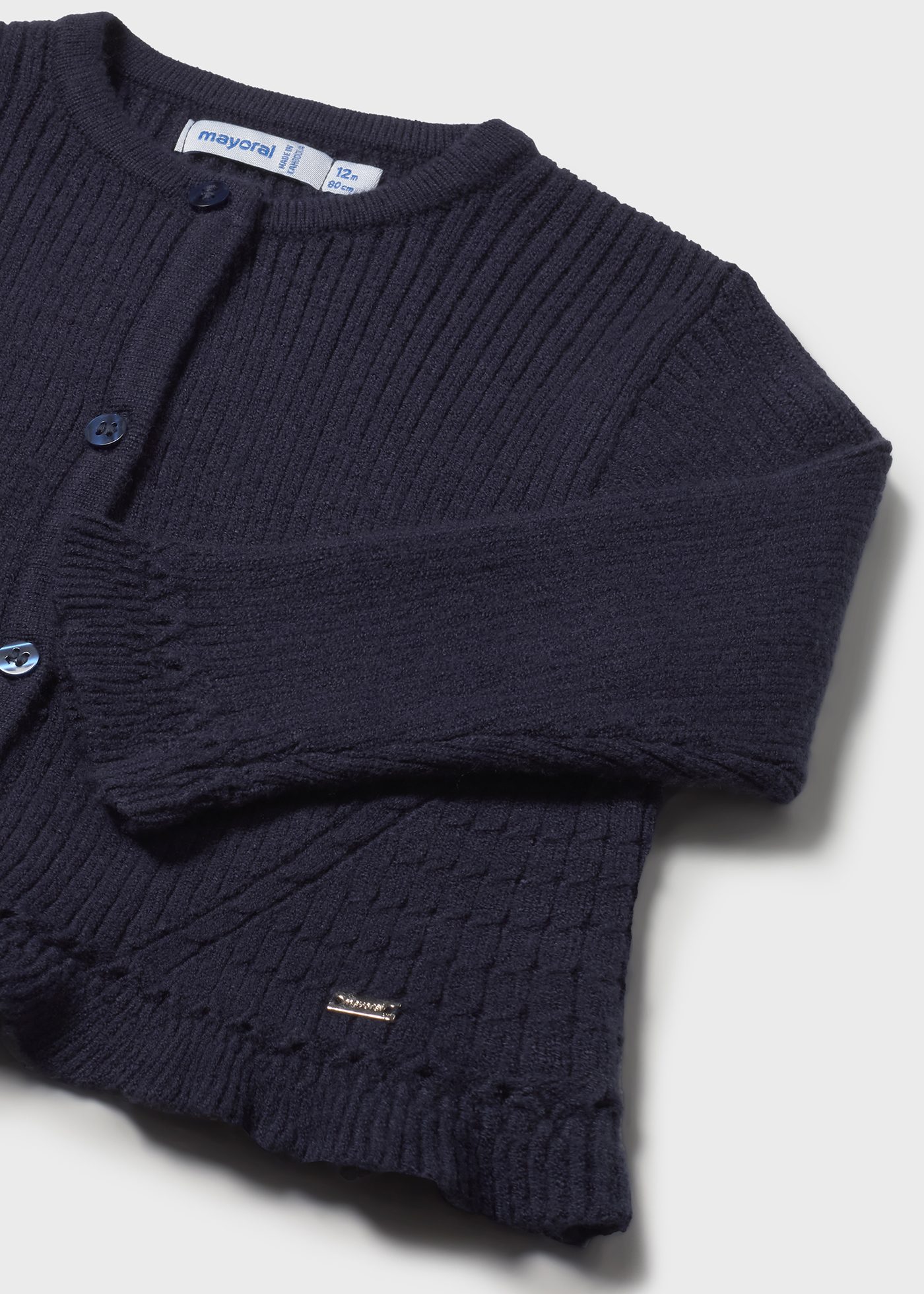 Sweterek trykotowy z falbanką dla niemowlęcia