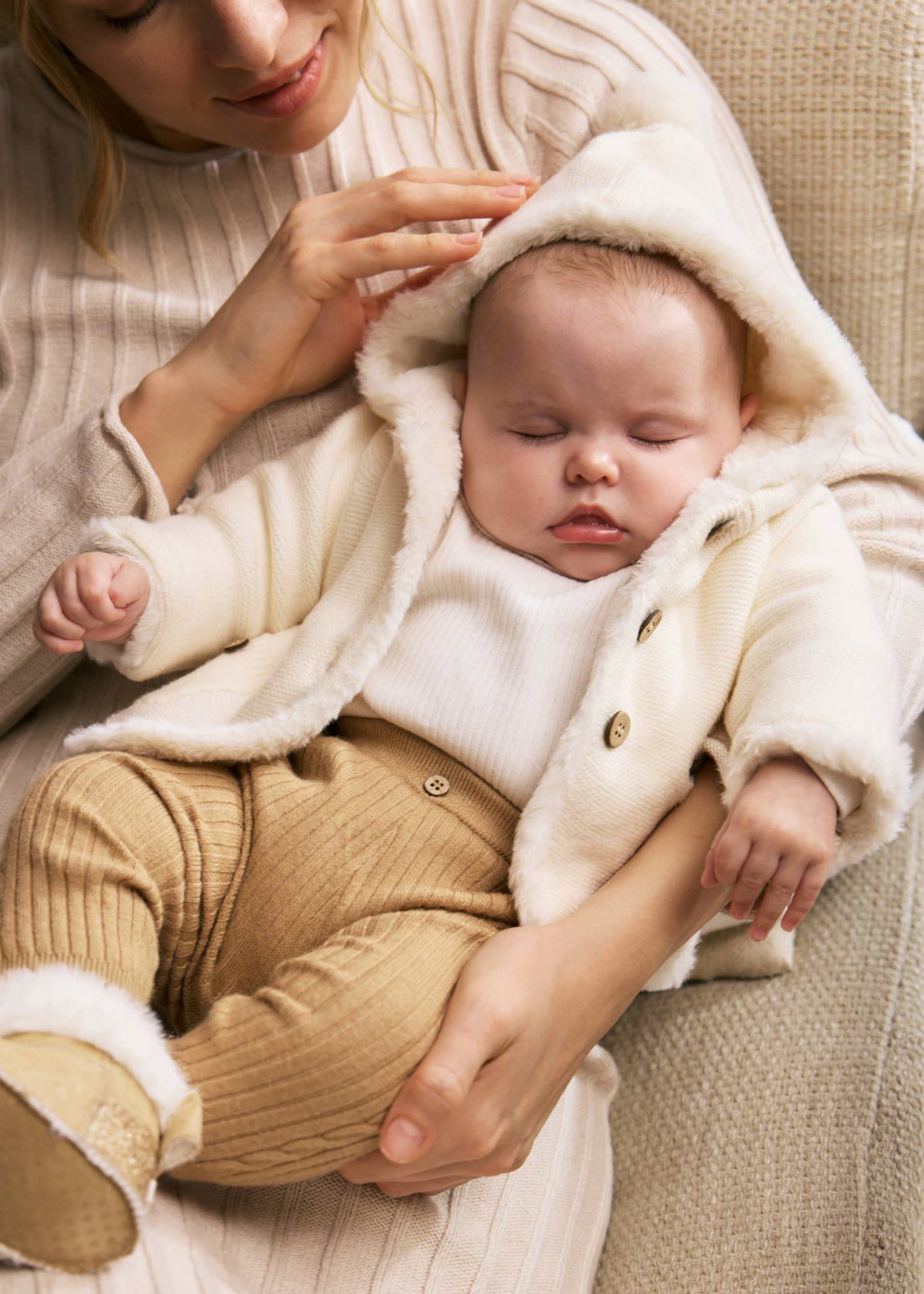 Newborn knitted jacket with fur