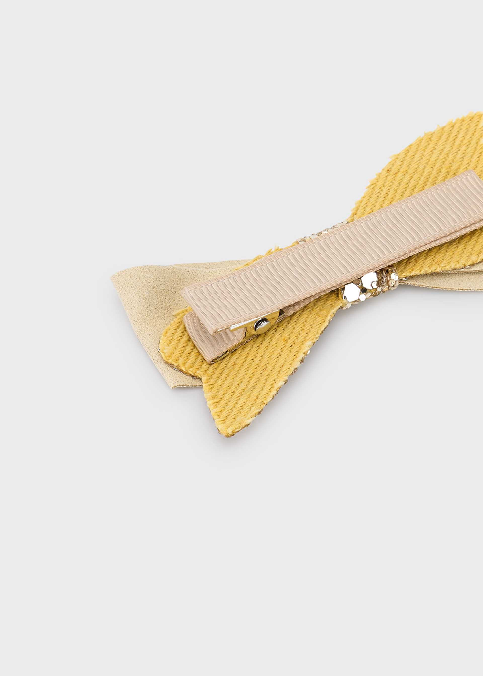 Pinza purpurina niña