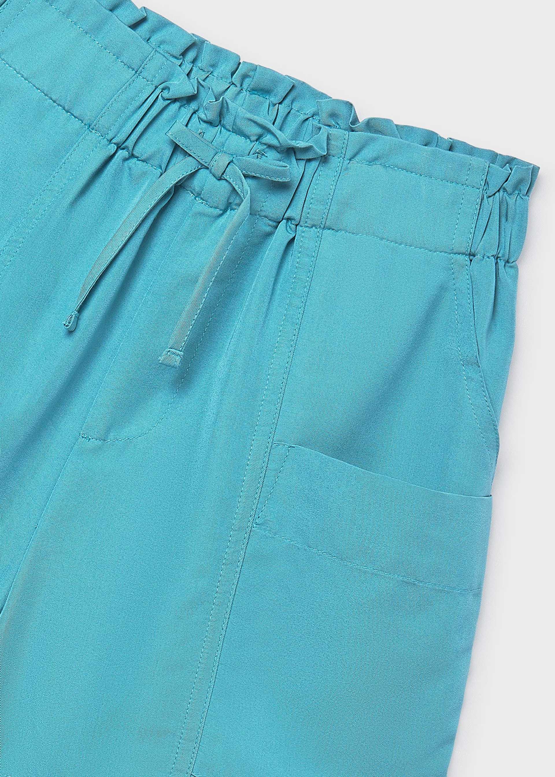 Pantalón corto bolsillos chica