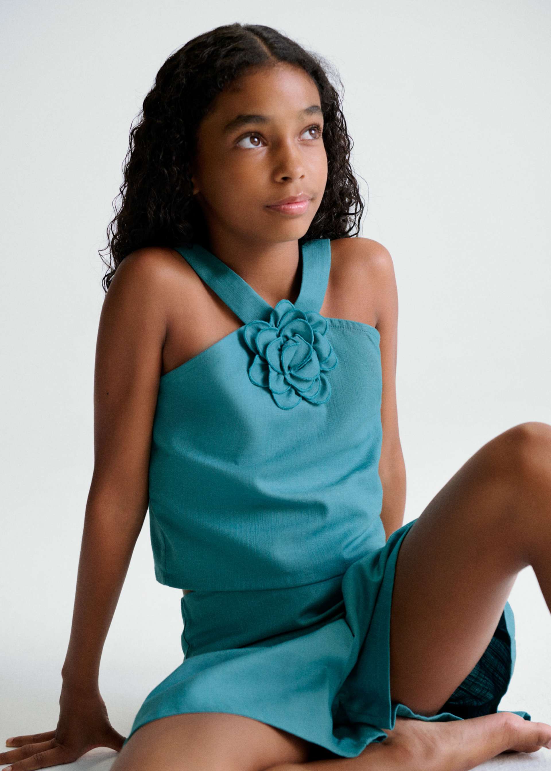 Set Shorts mit Blumen-Top Teenager Mädchen