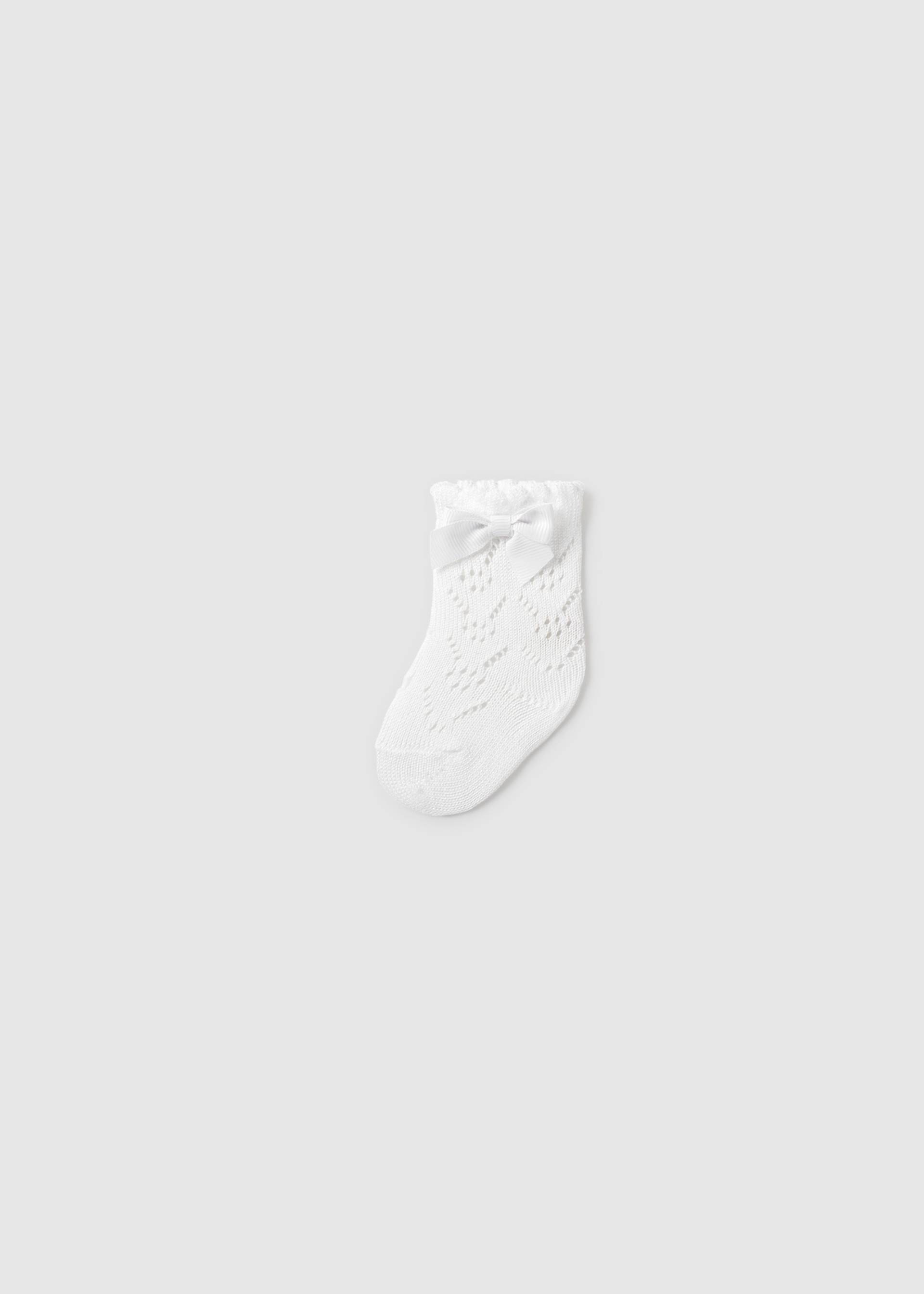 Chaussette ajourée à nœud nouveau-né