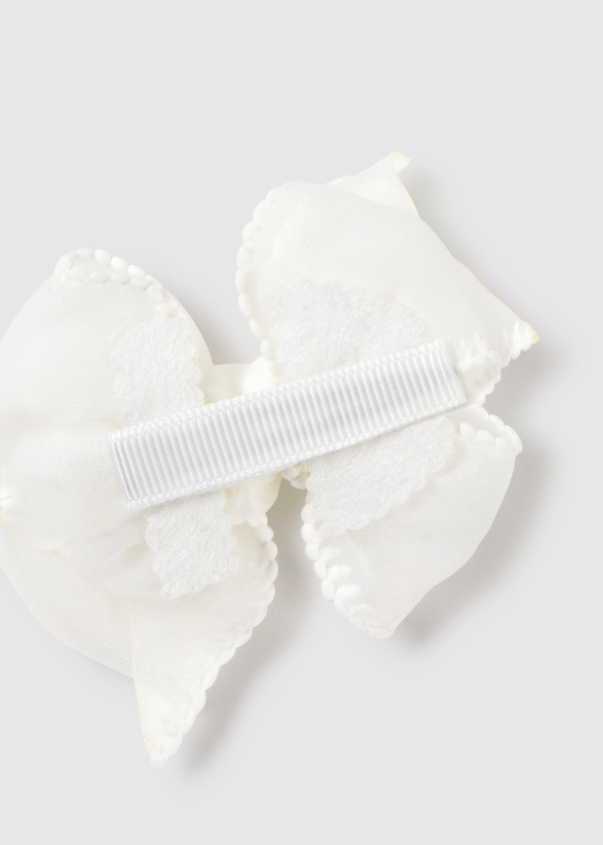 Cerchietto elasticizzato con fermaglio fiocco neonata