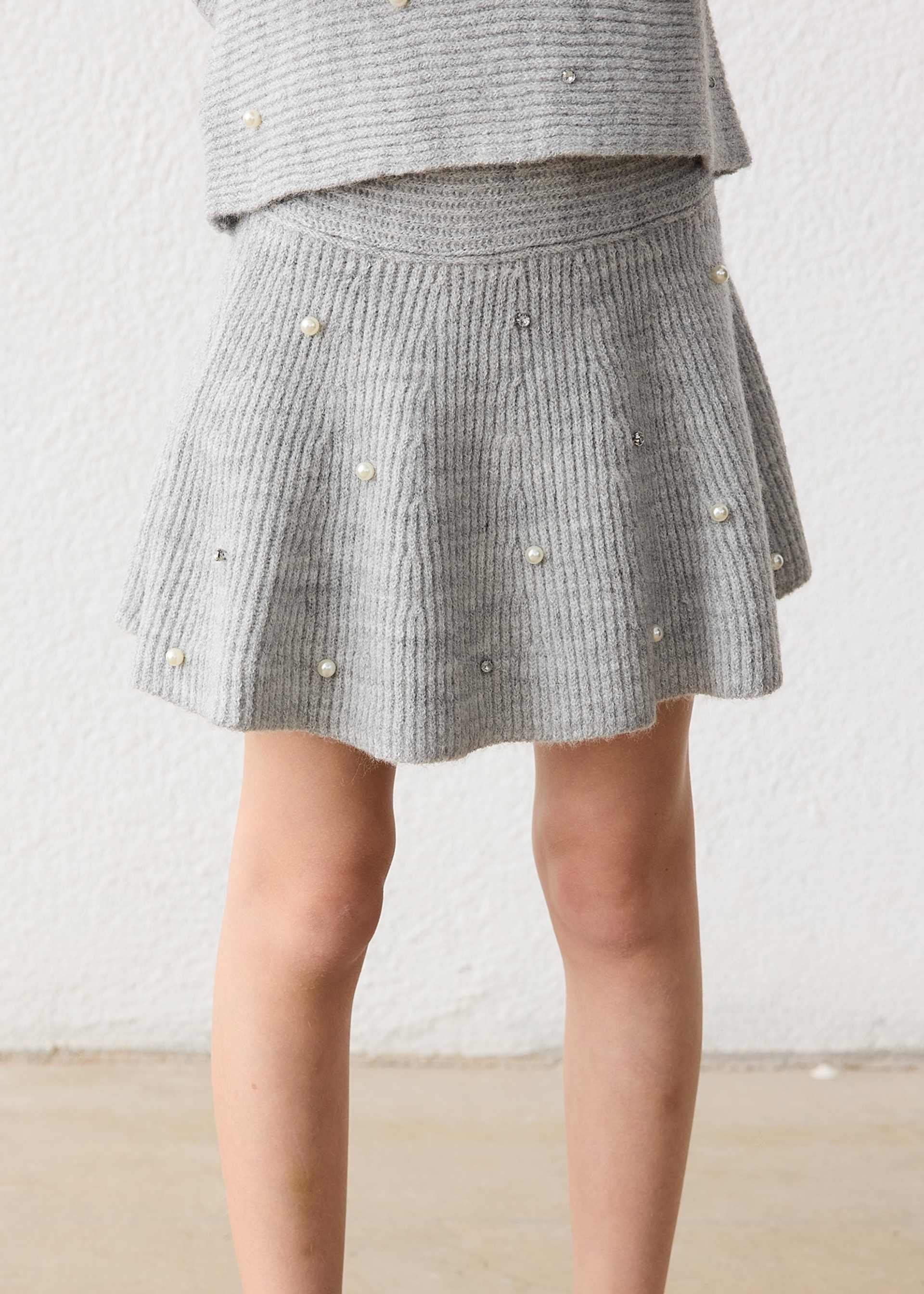 Falda tricot perlas niña