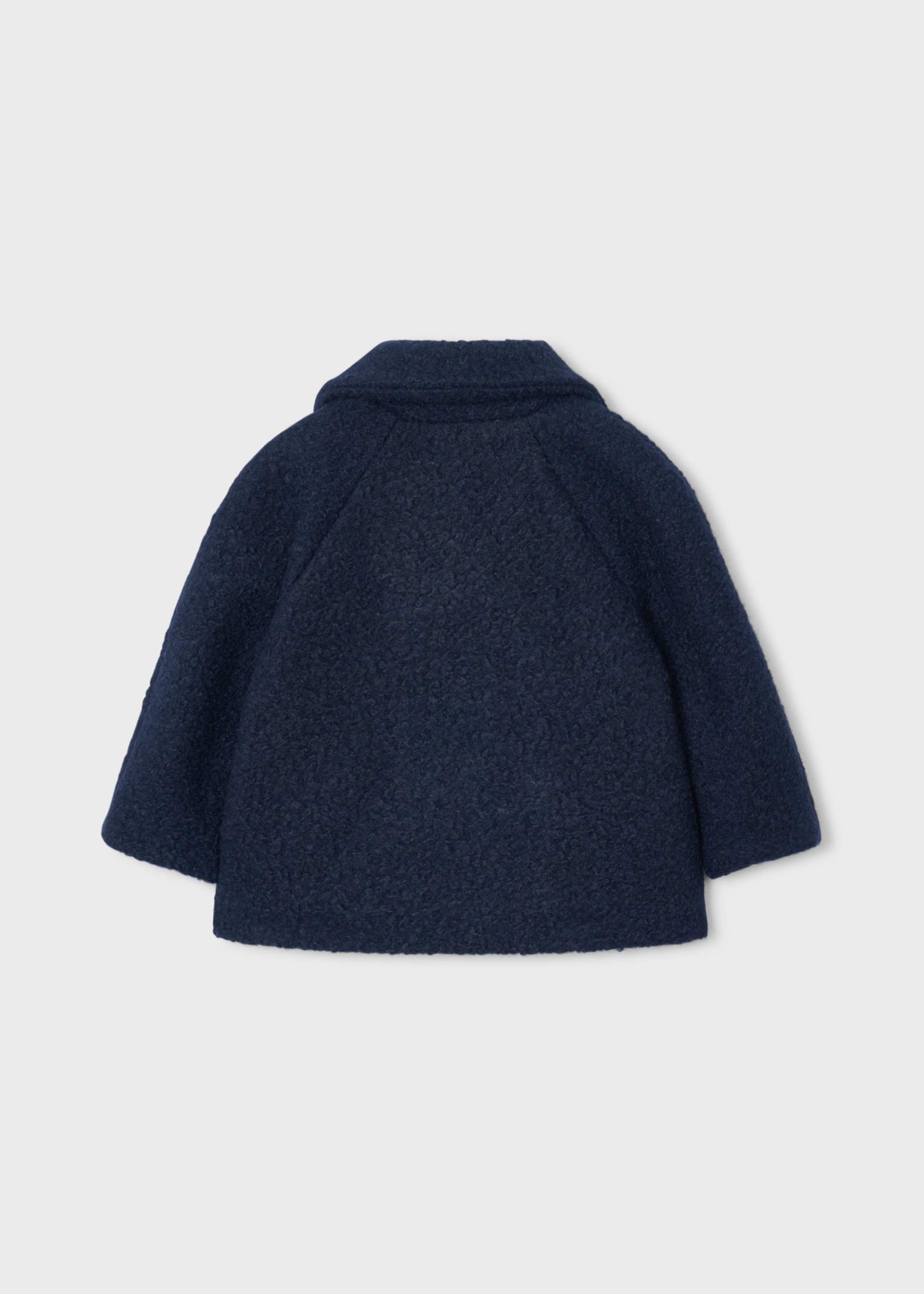 Manteau en laine bouclée avec sac