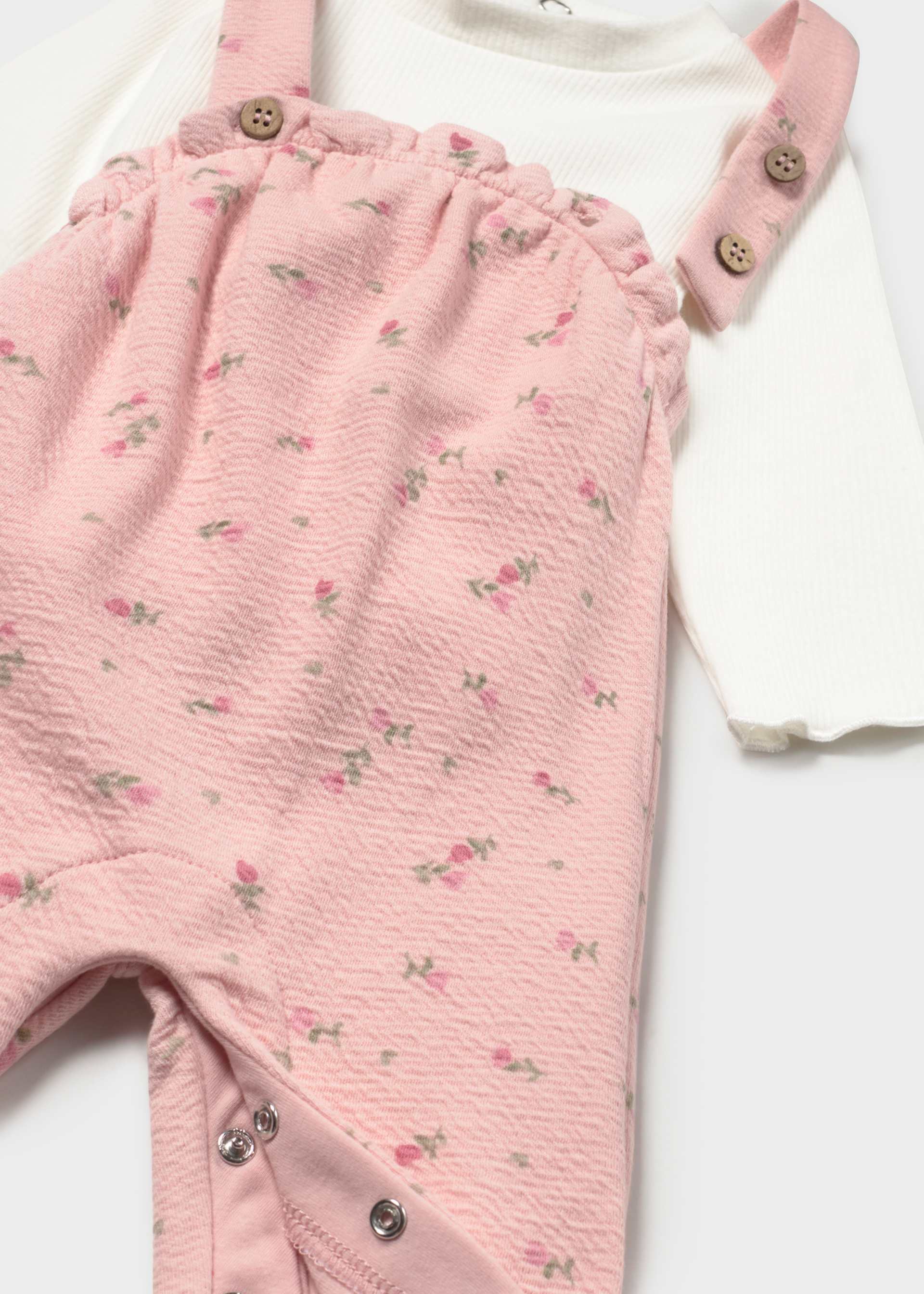 Ensemble salopette imprimée et pull nouveau-né