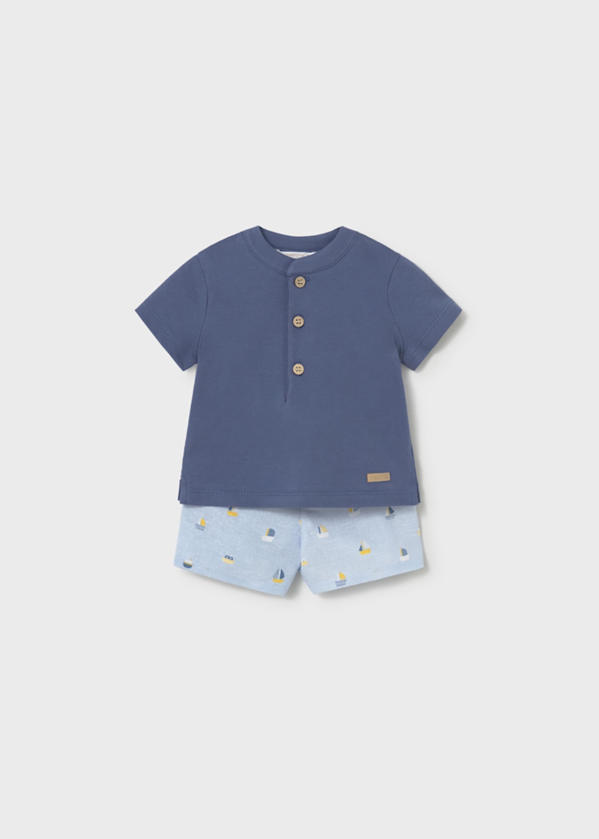 Conjunto calção estampado e polo recém-nascido