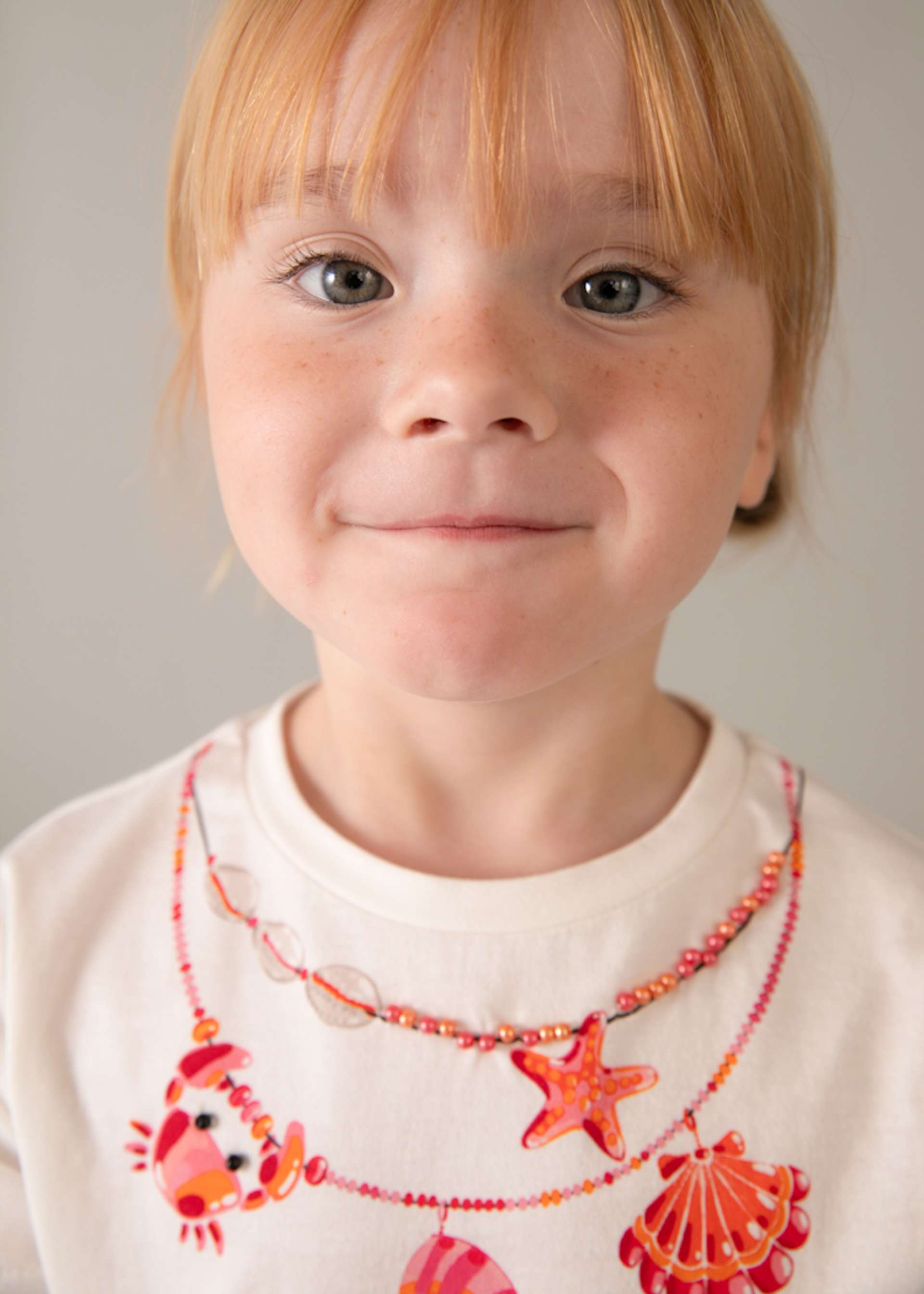 Completo shorts volant e maglietta stampata bambina