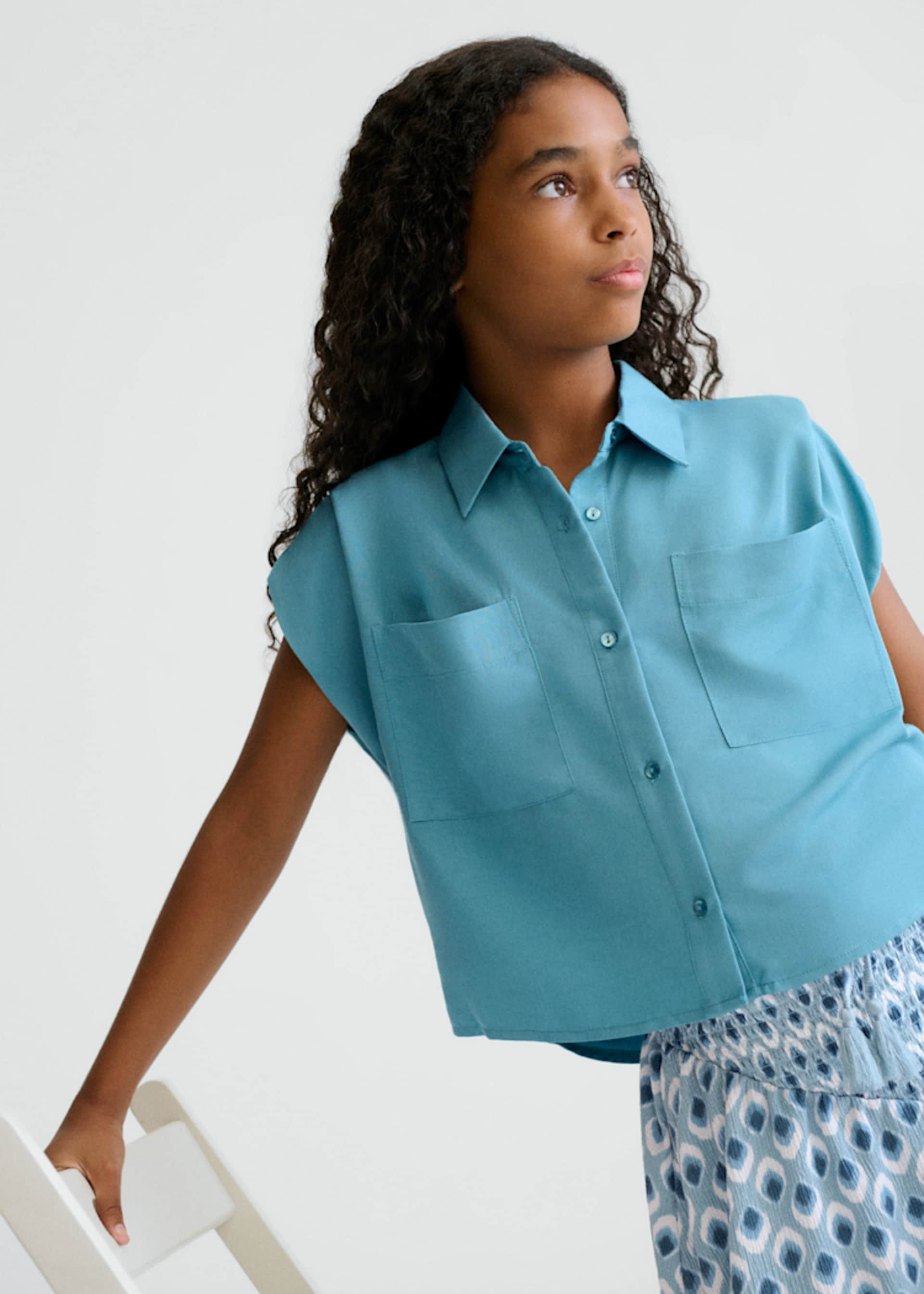 Blusa bolsillos chica