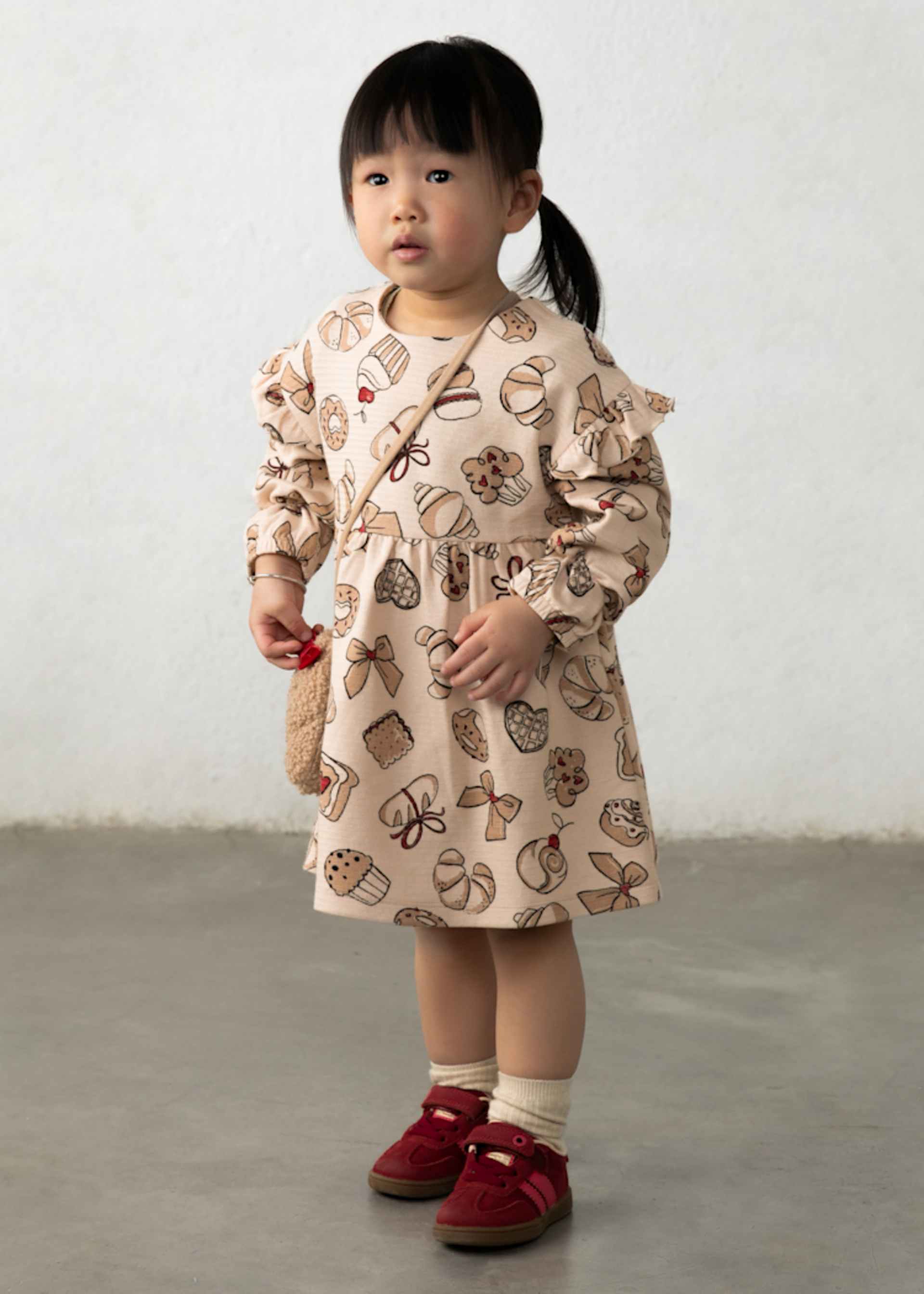 Printed dress with a baby bag